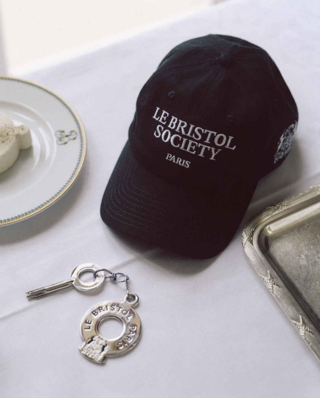 Le Bristol Paris le bristol society exclusive collection travel clothing luxury collaboration sporty & rich